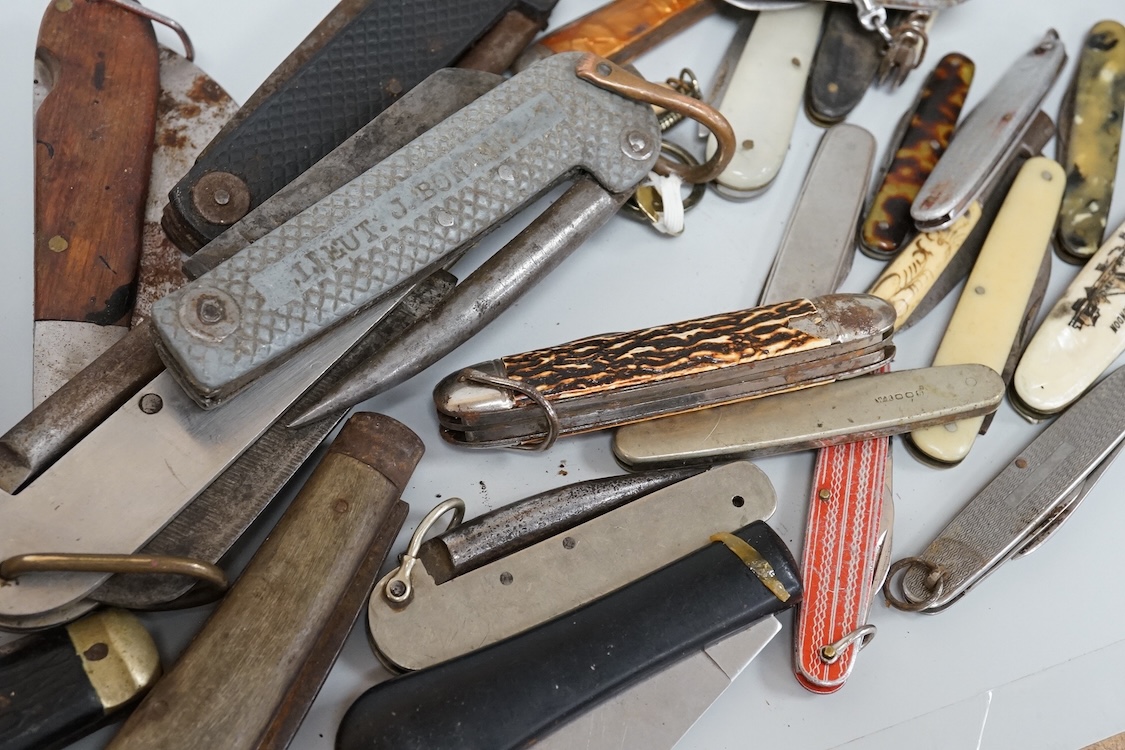 A collection of assorted penknives and whistles